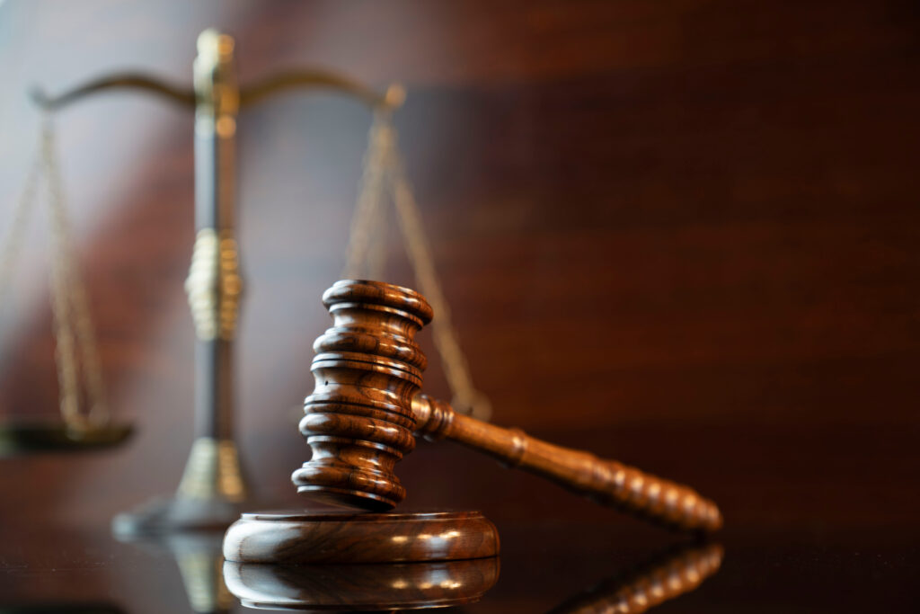 Gavel with scale in the background